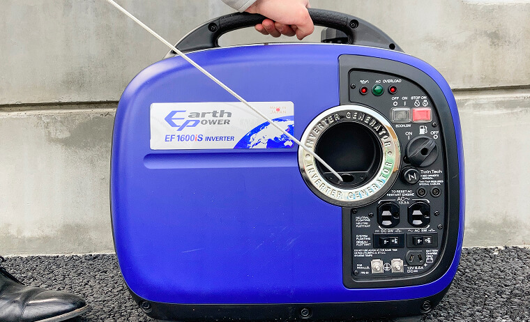 Photo of pulling the recoil starter handle